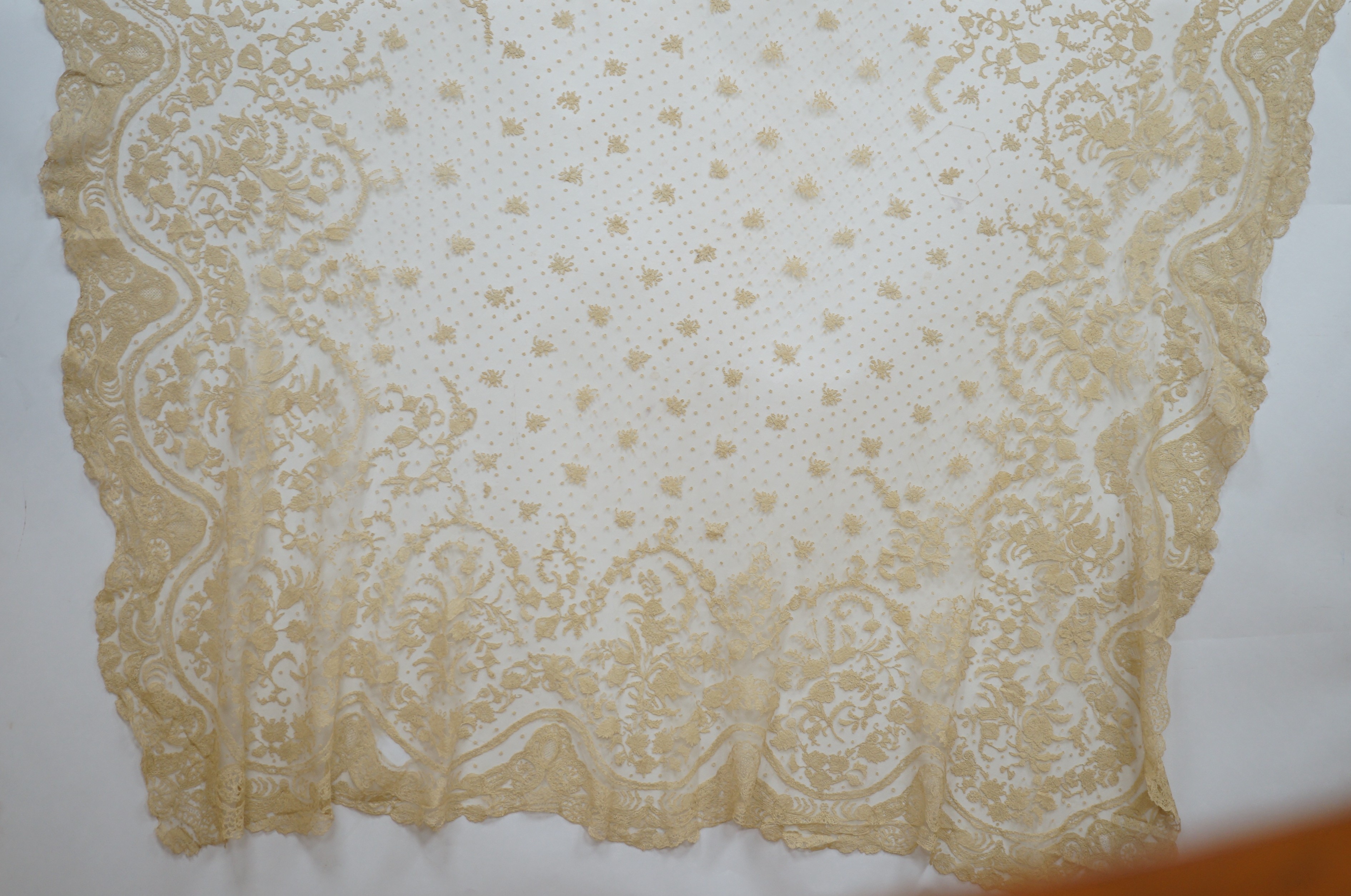 A rare length (9 and a half yards) of Brussels 19th century needle lace, some repairs and damage, circa 1880 and a similar wedding veil